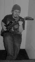 Photo of Robert playing guitar